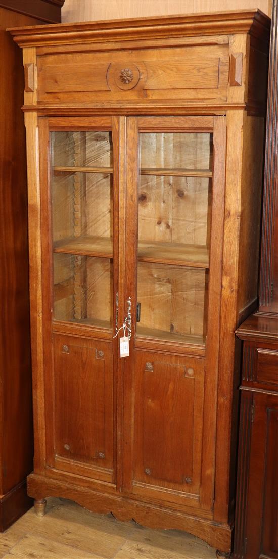 A 19th century French glazed oak bookcase H.186cm